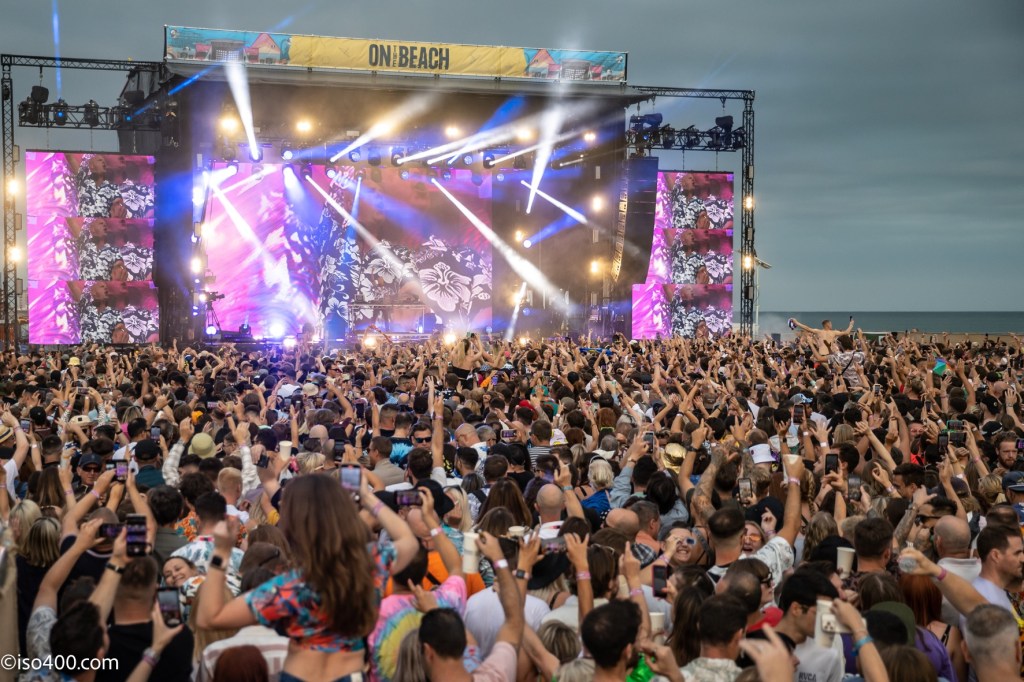 Fatboy Slim playing to fans on Brighton Beach